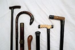 A silver topped and horn handled walking stick,