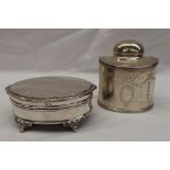 A George V silver tea caddy of oval form, decorated with swags and festoons to a vacant cartouche,