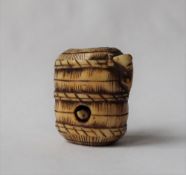 A 19th century Japanese ivory netsuke in the form of a basket,