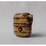 A 19th century Japanese ivory netsuke in the form of a basket,