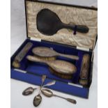 A George V silver part dressing table set, including a hand mirror,