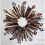A collection of lace bobbins, turned wood and bone,