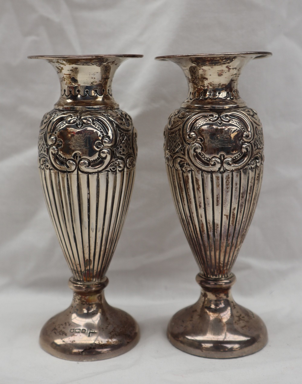 A pair of Edward VII silver vases with flared rims above a cylindrical body embossed with scrolls - Image 7 of 10