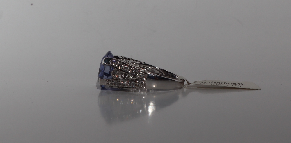 A sapphire and diamond ring, the oval faceted sapphire 14mm x 7mm, - Image 2 of 4