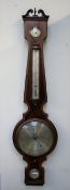 A 19th century mahogany banjo barometer, with a broken swan neck pediment, hydrometer dial,