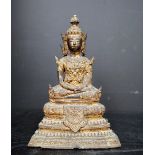 A gilt bronze figure of a seated buddha, on a stepped base, 18.
