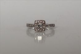 A princess cut diamond cluster ring,