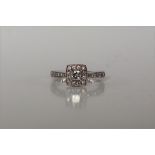 A princess cut diamond cluster ring,