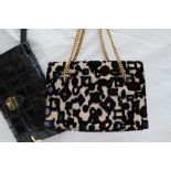 A Gucci handbag, with a stumpwork geometric pattern with a gilt metal handle,