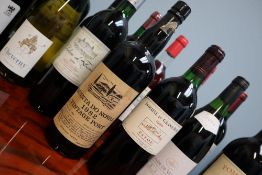 A bottle of Quinta Do Noval 1982 Port and a bottle of Domaine du Grand Bosc 1990 together with