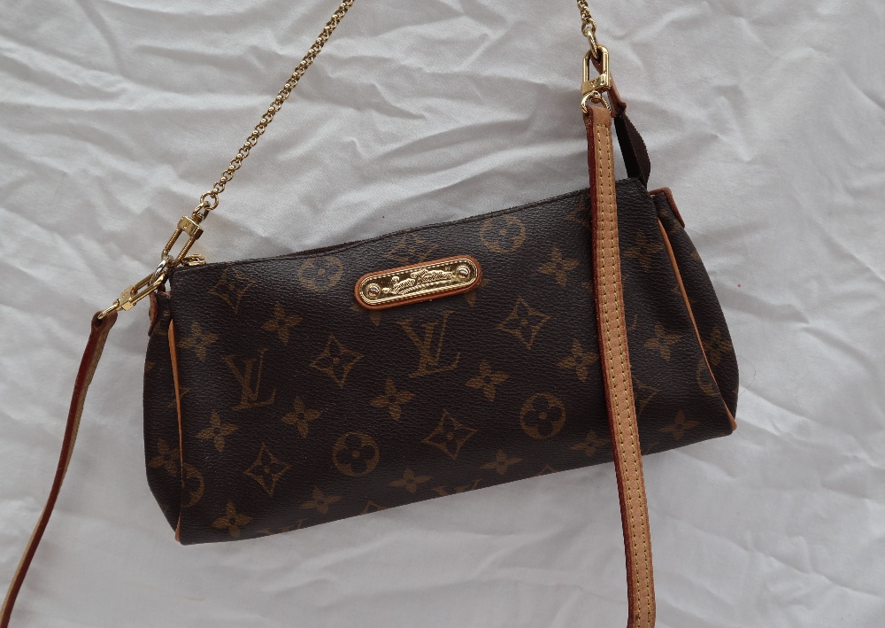 A small Louis Vuitton monogram clutch bag, with a leather shoulder strap,