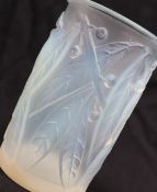 R Lalique, an opalescent cylindrical glass vase, decorated in the leaf and berry pattern,