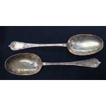 A pair of Victoria silver gilt table spoons, decorated with grapes and leaves, London, 1870, John,
