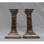 A pair of Victorian silver corinthian column candlesticks,