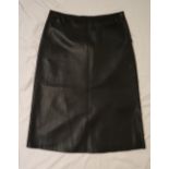 A Prada black leather skirt,
