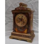 A late 19th century brass mantle clock, with an architectural pediment,