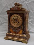 A late 19th century brass mantle clock, with an architectural pediment,