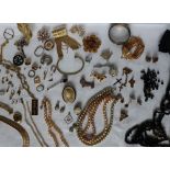 Assorted costume jewellery including faux pearls, brooches, pendants, bangle,