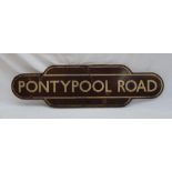 Railwayana - Totem for Pontypool Road, with a brown ground and cream lines,