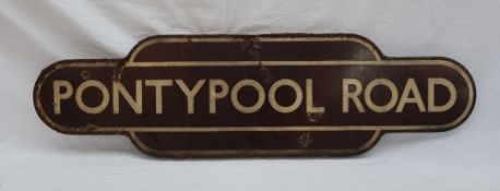 Railwayana - Totem for Pontypool Road, with a brown ground and cream lines,