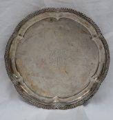 An Edward VII silver salver, with a lobed gadrooned edge, the centre engraved,