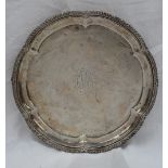 An Edward VII silver salver, with a lobed gadrooned edge, the centre engraved,