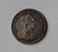 A George III five shillings dollar coin,