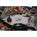A large quantity of costume jewellery including necklaces, earrings,