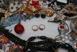 A large quantity of costume jewellery including necklaces, earrings,