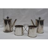 A George V silver four piece set comprising a pair of chocolate pots,