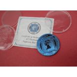 A Pobjoy Mint £5 Titanium Tuppery Blue coin with certificate