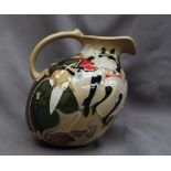 A Moorcroft pottery jug, decorated in the "Pigalle" pattern,