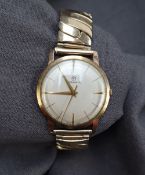 A Gentleman's 9ct yellow gold Rodania wristwatch, the silvered dial with batons,