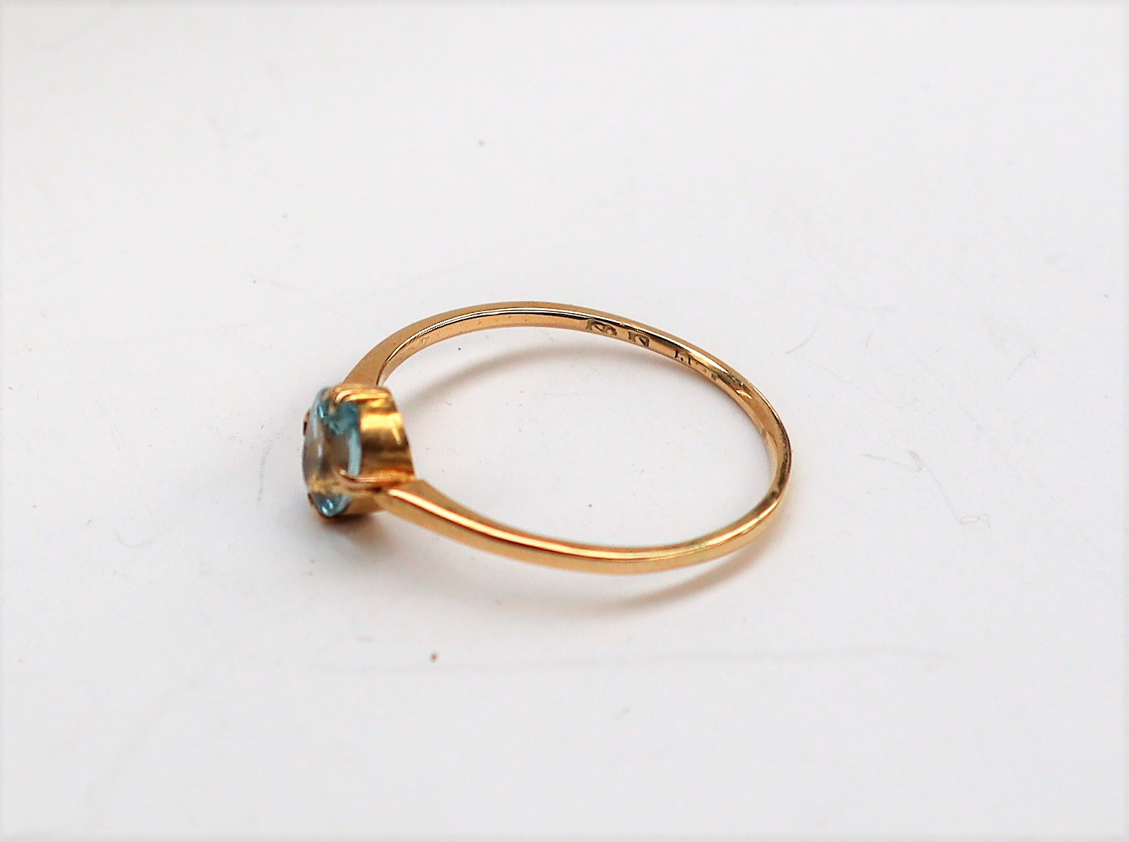 An aquamarine ring, the oval faceted aquamarine to a yellow metal setting and shank, size Q, - Image 3 of 4