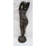 An Elizabeth Anne Clapp plaster figure of a nude, standing with her arms above her head,
