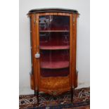 A continental kingwood vitrine, the oval shaped top above a glazed door and glazed sides,