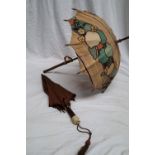 A carved bamboo handled parasol together with an ivory,