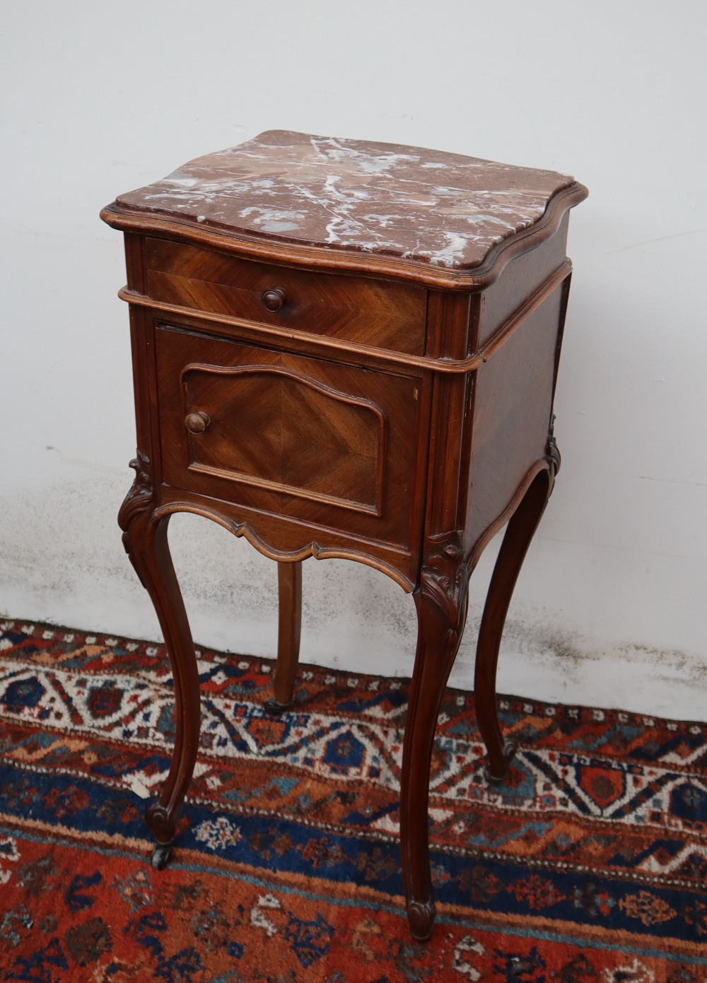 A French marble topped side cabinet,