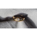 An 18ct gold ring, set with a round old cut diamond, size L, approximately 3.