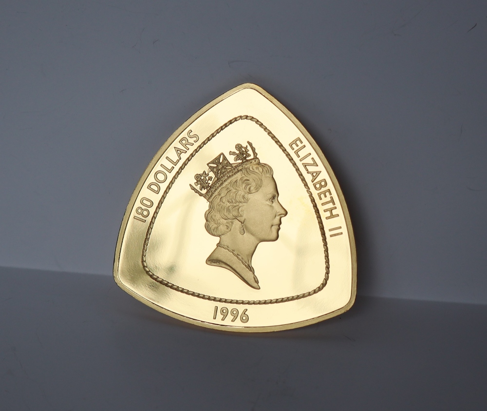 A 1996 Bermuda gold proof Triangular 180 dollars coin, No.48 / 99, 155.52 grams, . - Image 2 of 7