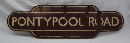 Railwayana - Totem for Pontypool Road, with a brown ground and cream lines,