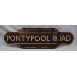 Railwayana - Totem for Pontypool Road, with a brown ground and cream lines,