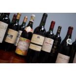 A bottle of Val de Montferrand Domaine de la Tour de Vias 2001 together with a selection of red