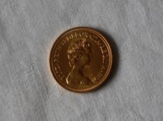 An Elizabeth II gold sovereign dated 1980