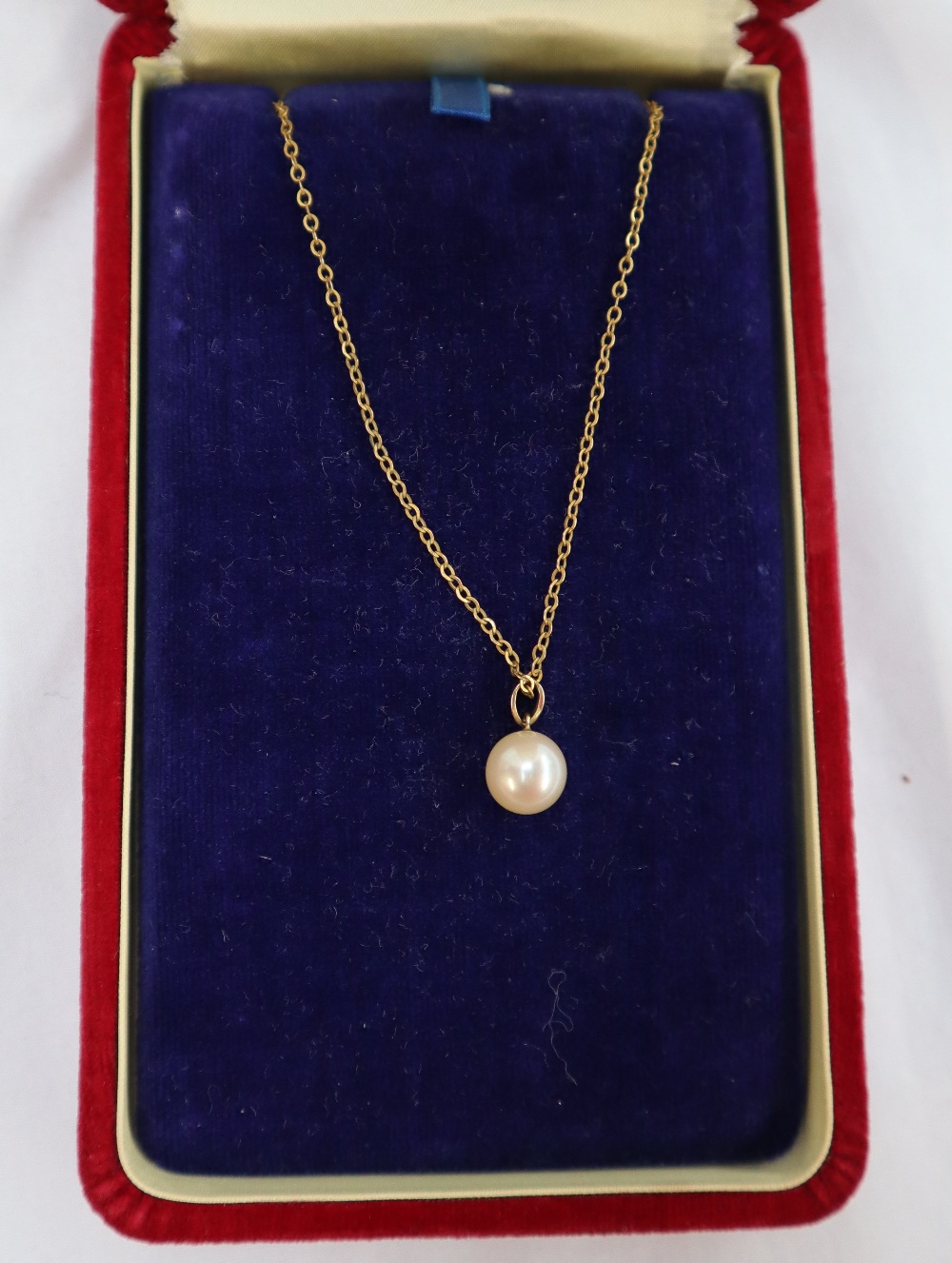 A Mikimoto pearl pendant on a 14ct gold suspension loop on a yellow metal chain, - Image 3 of 5