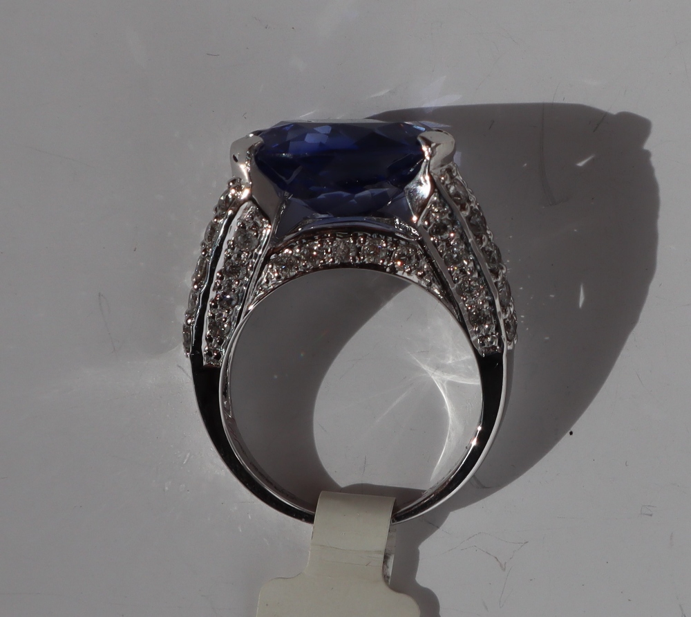 A sapphire and diamond ring, the oval faceted sapphire 14mm x 7mm, - Image 4 of 4