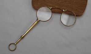 A pair of 19th century gilt metal folding spectacles, with spring loaded action,