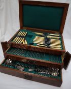 An oak cased electroplated part flatware service, with a hinged lid and two drawers 47cm wide x 31.