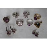 A 9ct gold amethyst set dress ring together with assorted silver rings and earrings set with purple