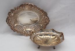 An Elizabeth II silver bon bon dish of oval pierced form embossed with flowerheads and scrolls,